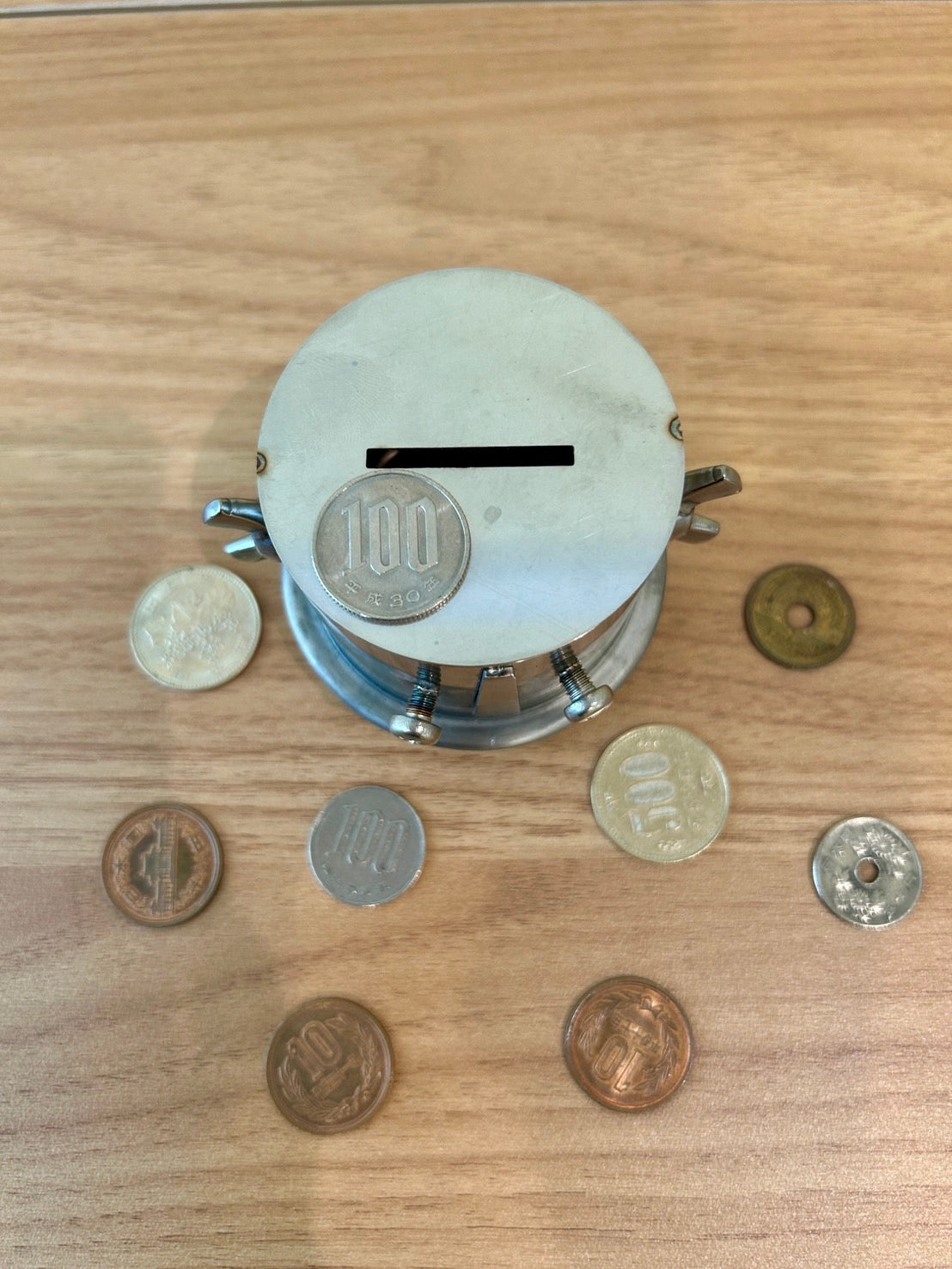 Unretrievable piggy-bank made of stainless steel handmade by craftman Japan