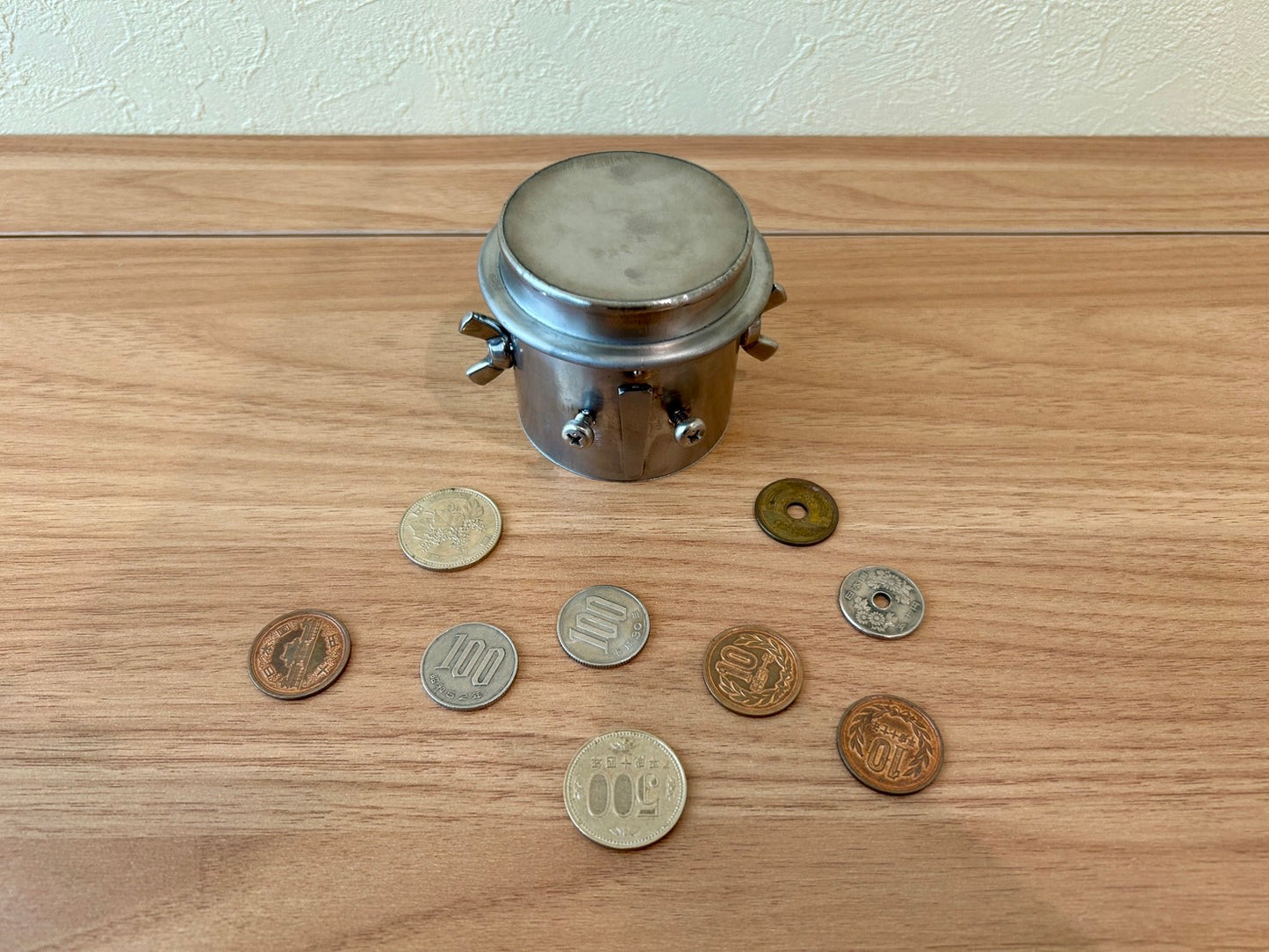 Unretrievable piggy-bank made of stainless steel handmade by craftman Japan